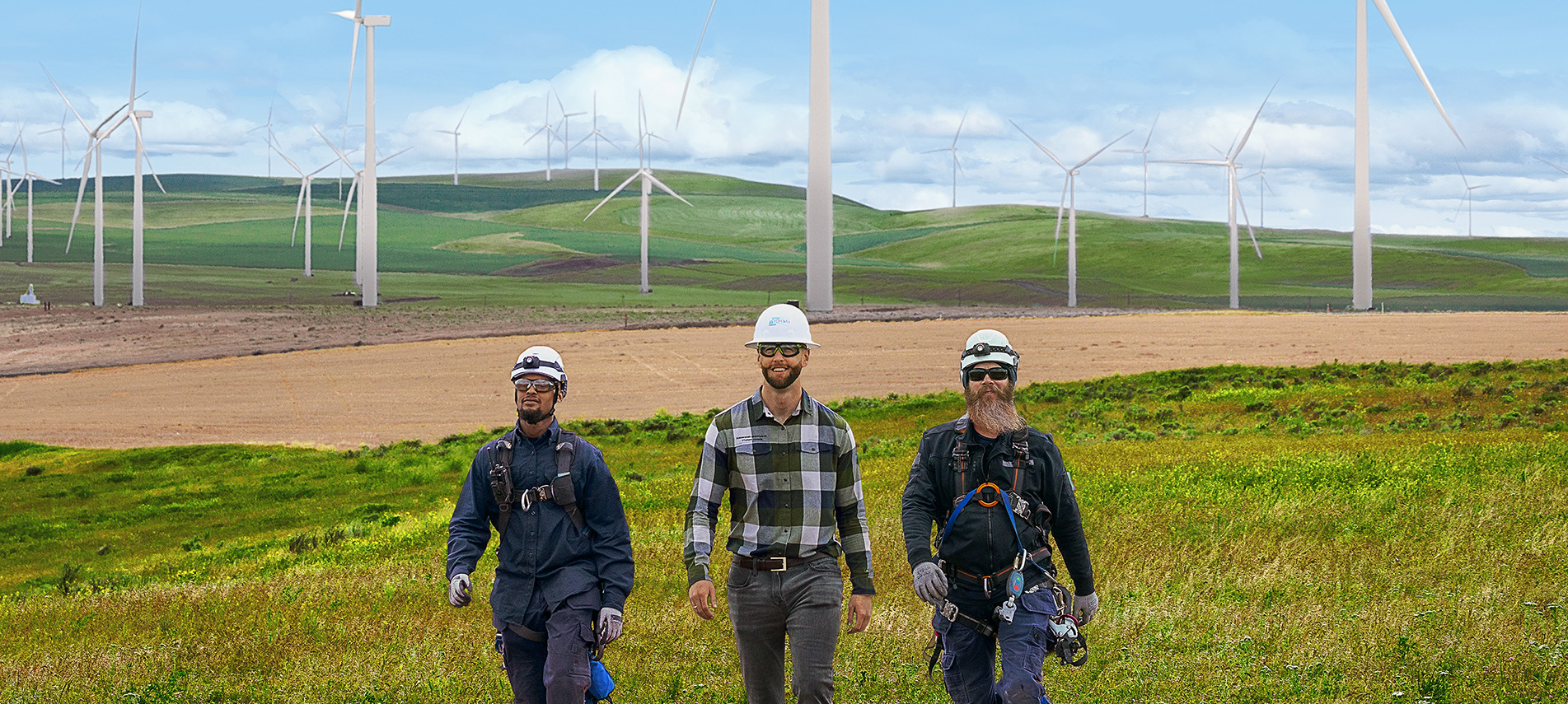 NextEra Energy enineers walking by the wind towers