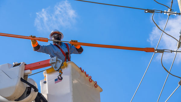 A NextEra Energy line worker fixing transmission pole in Texas A NextEra Energy line worker fixing transmission pole in Texas