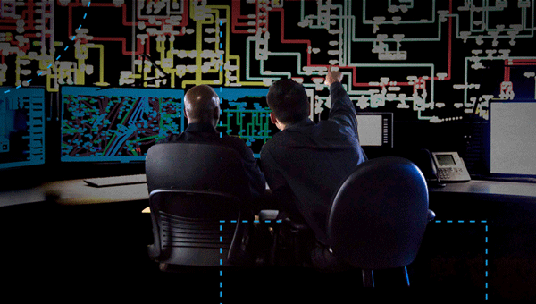 Two employees working on computers Two employees working on computers