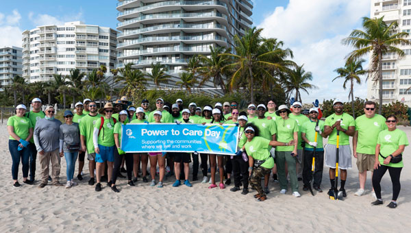Group picture of the Power to Care Beach clean up event 