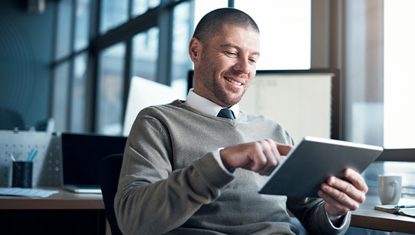 man-working-on-a-tablet man-working-on-a-tablet