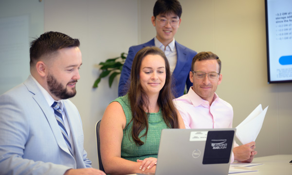 NextEra Energy team of financial experts collaborating on tax credit solutions.