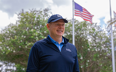 NextEra Energy veteran by the American flag
