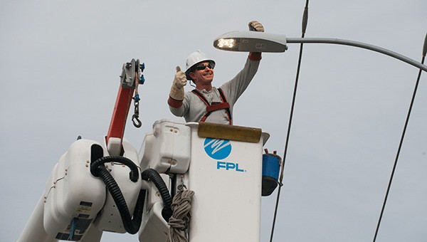 FPL employee installing a street light
