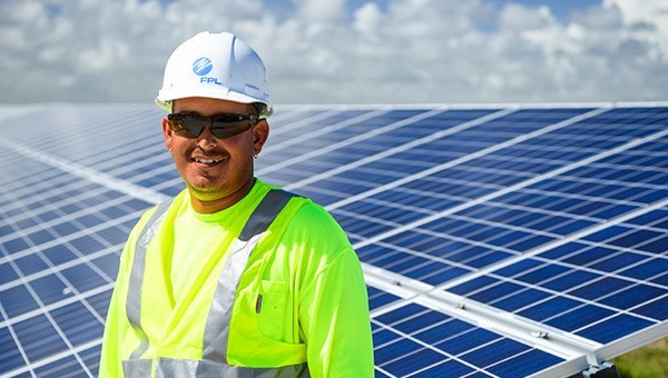 FPL employee with solar panels