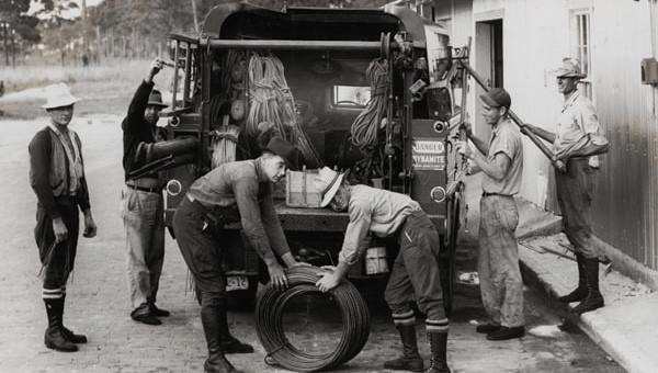 FPL employees loading power lines on a truck