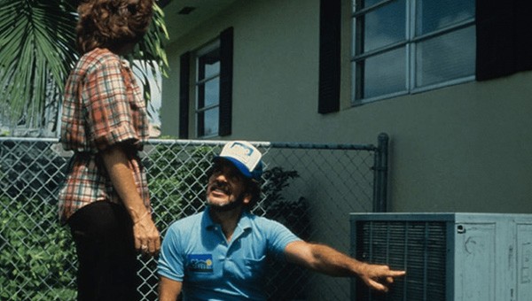 FPL employee explaining an air conditioner to a customer
