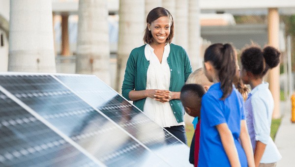 Instructor teaching students at a Solar Education Station