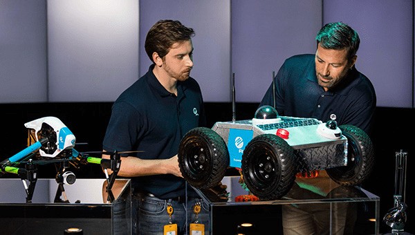 Two men presenting at the Power Delivery Diagnostic Center