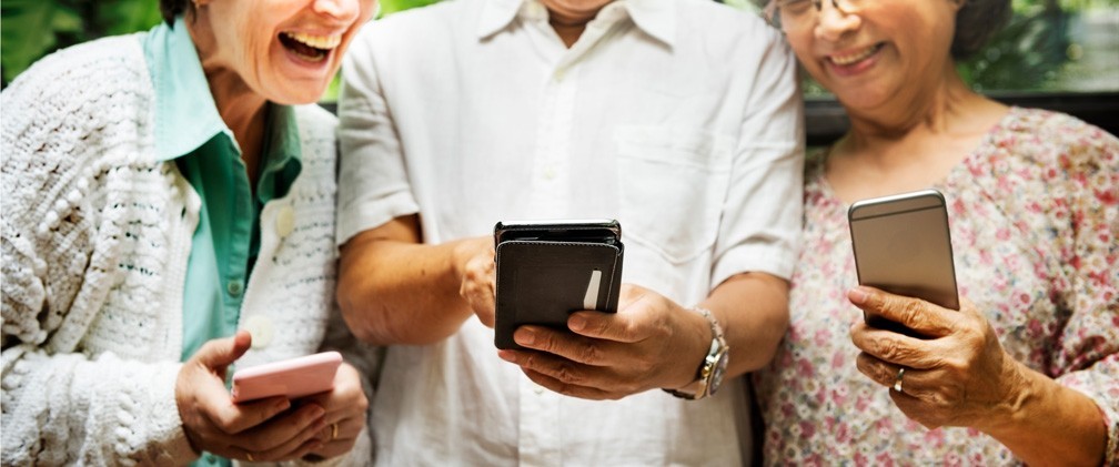 Retirees checking their phones