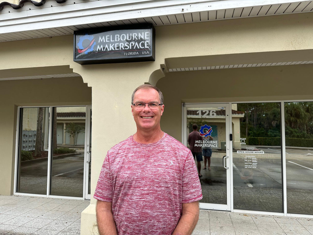 David Young, retiree, standing outside of a building