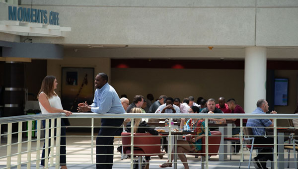 Employees gathering at the company's Cafe Employees gathering at the company's Cafe